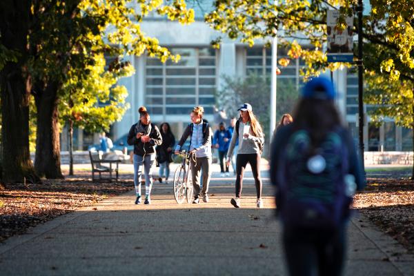 Students walk outside on campus 