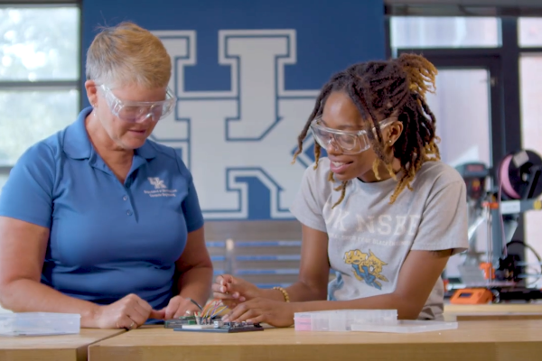 This is a photo of a faculty and student mentorship at UK.