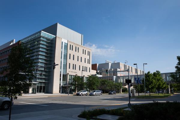 The UK College of Pharmacy building view from the street during the day.
