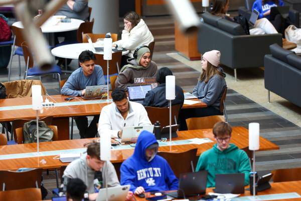 Students sitting in rows of desk in the Gatton College of Business.