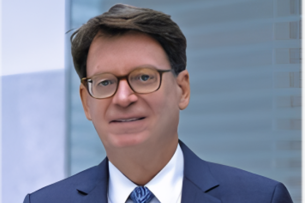 Jim Duff, wearing a navy blue suit and light blue tie for a portrait, is named the interim dean of the J. David Rosenberg College of Law at UK.