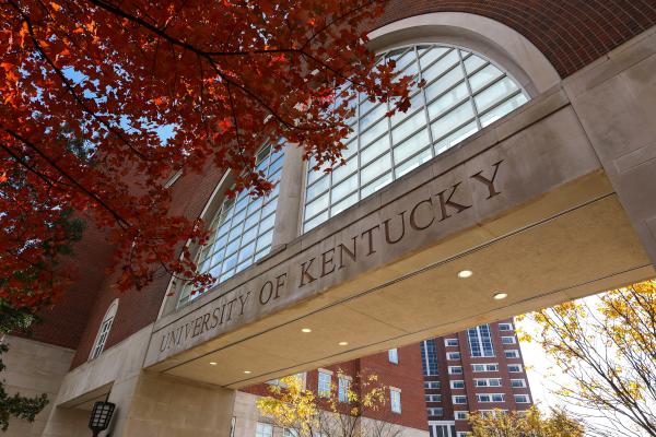 Arch engraved with "University of Kentucky" and fall foliage.