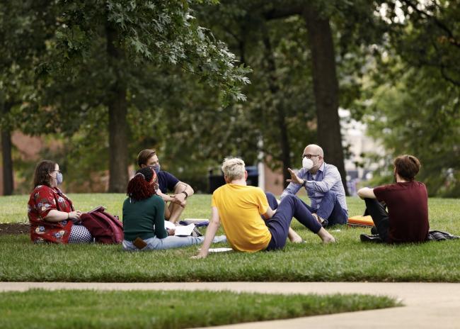 Professor teaching class outside