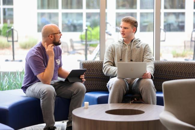 An advisor and student talking during the Getting Classy registration event at UK.