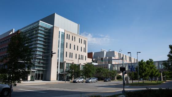 The UK College of Pharmacy building view from the street during the day.