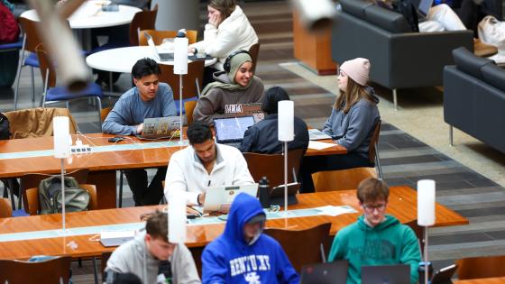 Students sitting in rows of desk in the Gatton College of Business.