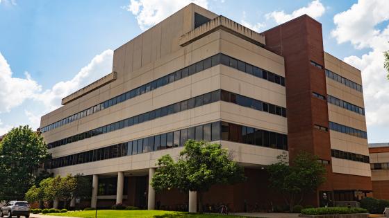 The College of Nursing at UK, a limestone facade building with five stories seen from outside.