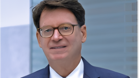 Jim Duff, wearing a navy blue suit and light blue tie for a portrait, is named the interim dean of the J. David Rosenberg College of Law at UK.