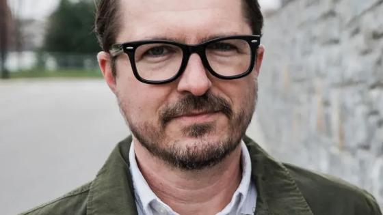Headshot of Jeff Fugate in a white collared shirt and dark jacket.