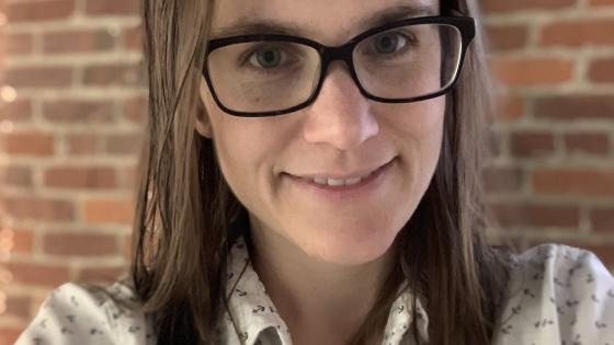 Becky Alley in a patterned collared shirt.