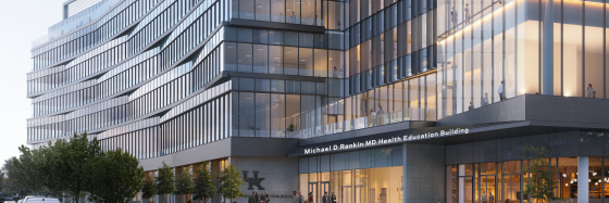 rendering of new education building with many windows. 