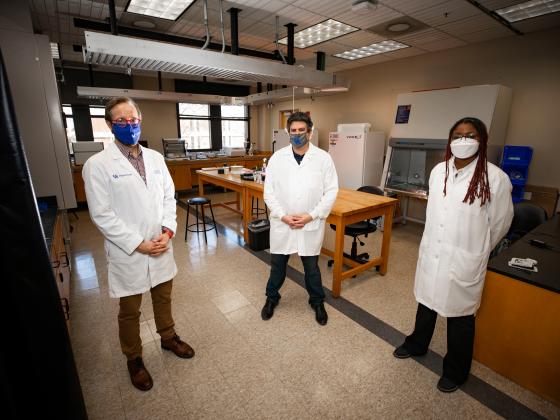 Photo of professors standing in a lab