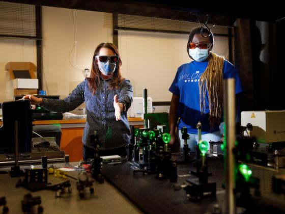 Photo of engineering professor helping student