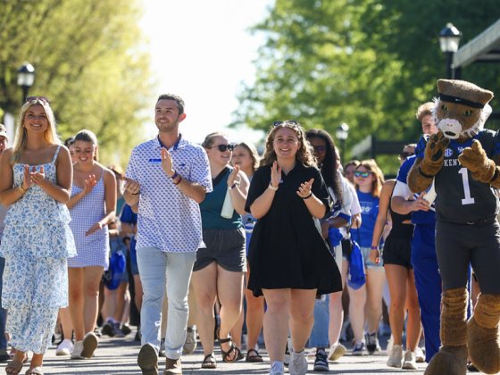 Soon to be graduates participate in a new tradition on campus: walking through the gates of Alumni Commons as UK Alumni cheer them on from the other side on