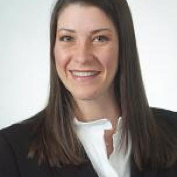 Headshot of Enif Dominguez-Fernandez in a white shirt and black blazer.