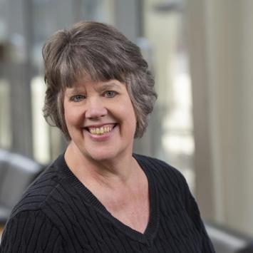Headshot of Trish Freeman in a black shirt.