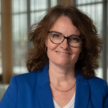 Headshot of Erin Haynes in a blue blazer.