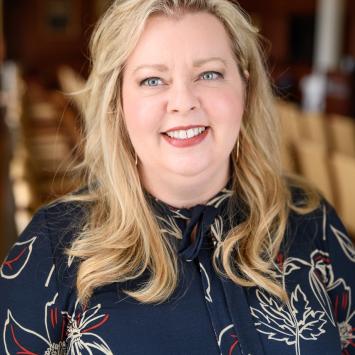 Headshot of Stephanie Ratliff in a blue patterned shirt.