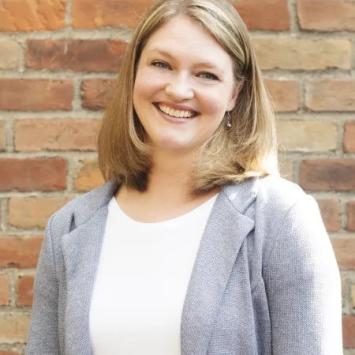 Headshot of Jessalyn Vallade in a gray blazer.