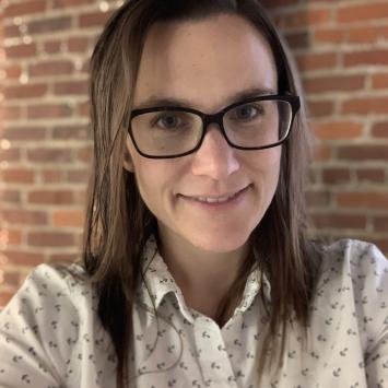 Becky Alley in a patterned collared shirt.