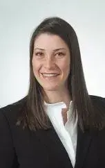 Headshot of Enif Dominguez-Fernandez in a white shirt and black blazer.