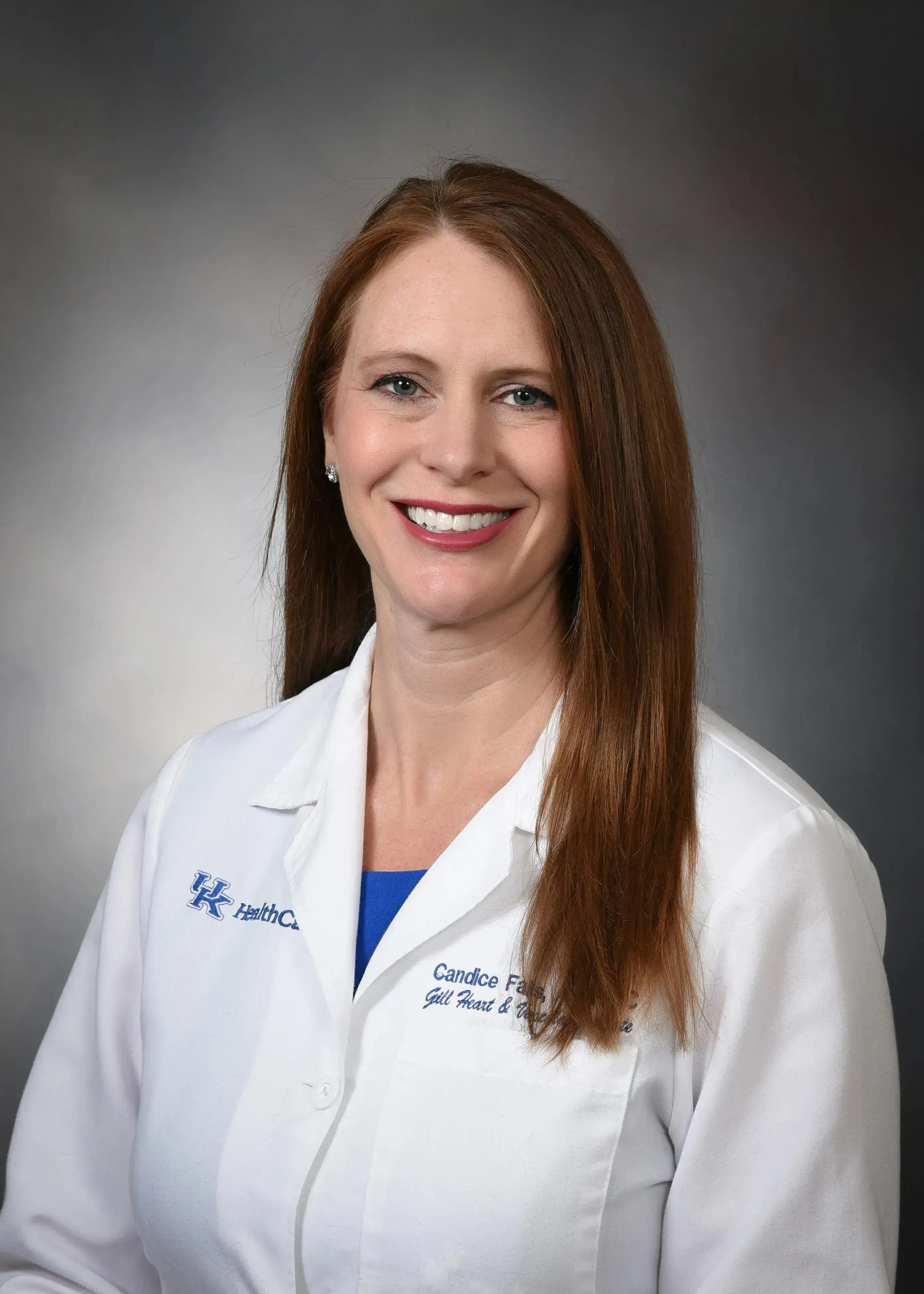 Headshot of Candice Falls in a medical white coat.