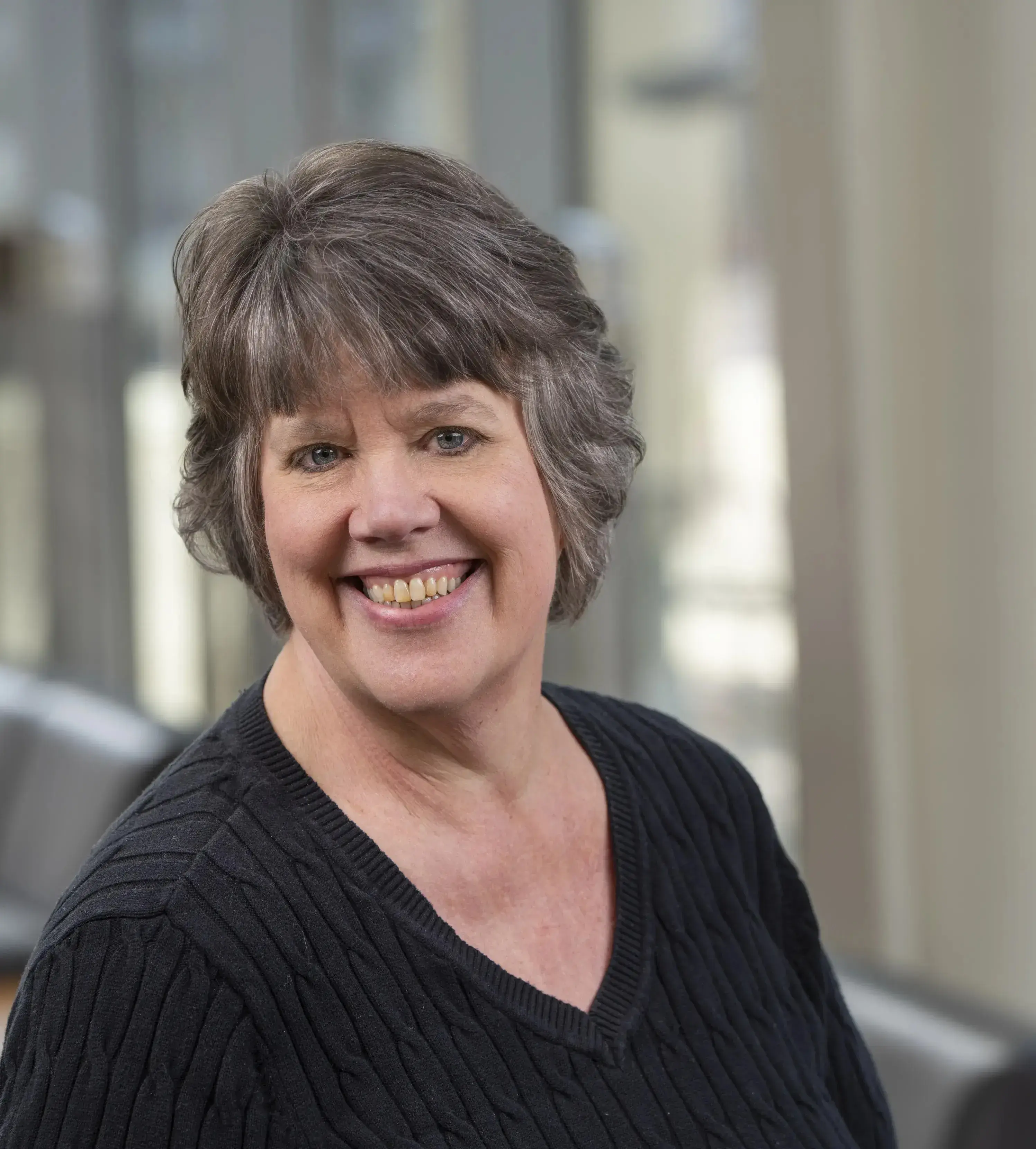 Headshot of Trish Freeman in a black shirt.
