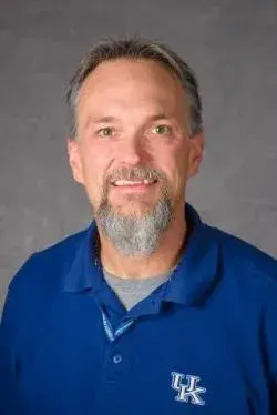 Headshot of Gregg Rentfrow in a blue collared shirt.